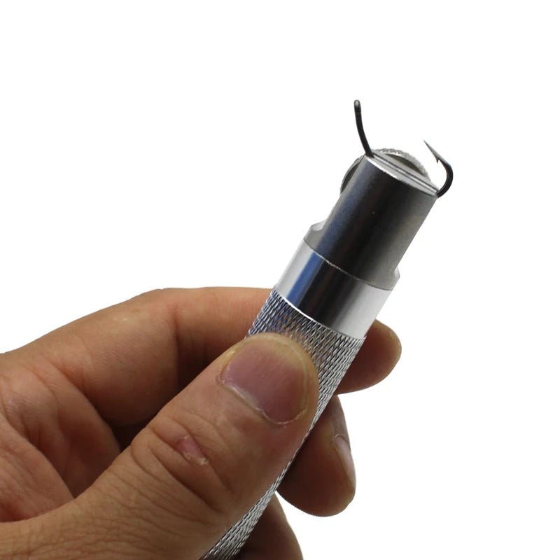 Close-up of aluminium hook sharpening tool holding fishing hook securely for sharpening