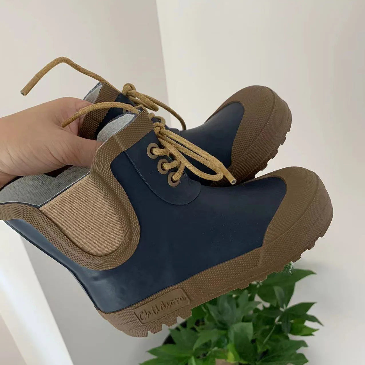 Blue lace up kids gumboots with waterproof upper and anti slip sole