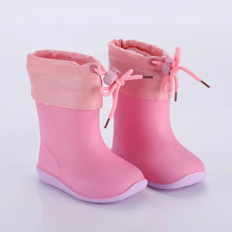 Pink lined kids rain boots designed for outdoor play and warmth