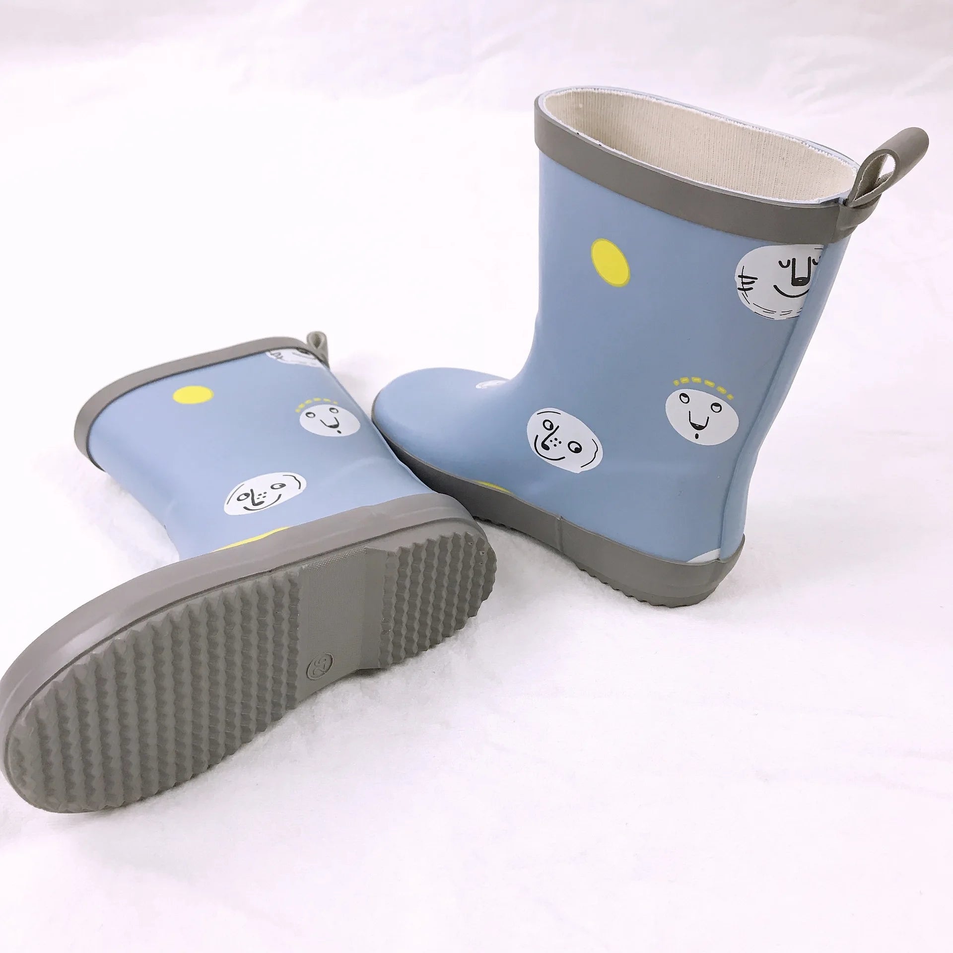 Blue kids printed gumboots showing sole and side profile