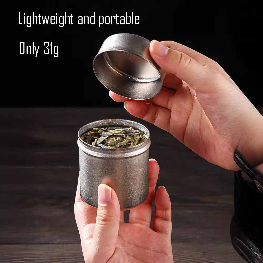 Lightweight titanium tea can held in hand, weighing just 31 grams for travel or everyday carry use