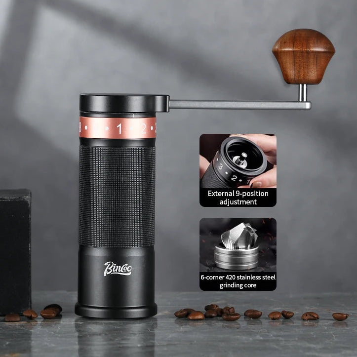 Black manual coffee grinder with adjustable grind settings