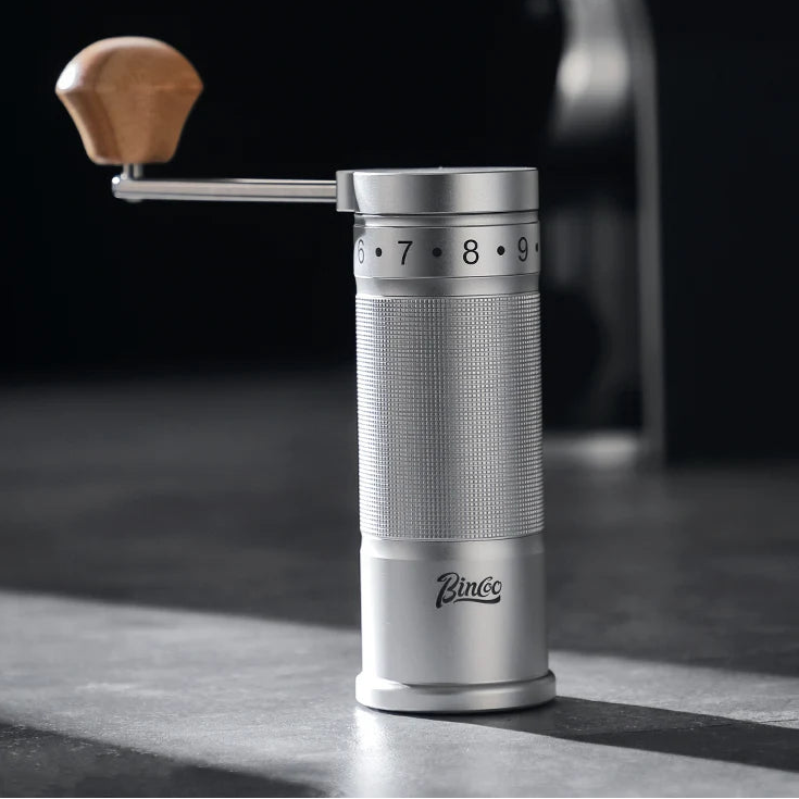 Manual stainless steel coffee grinder with wooden handle