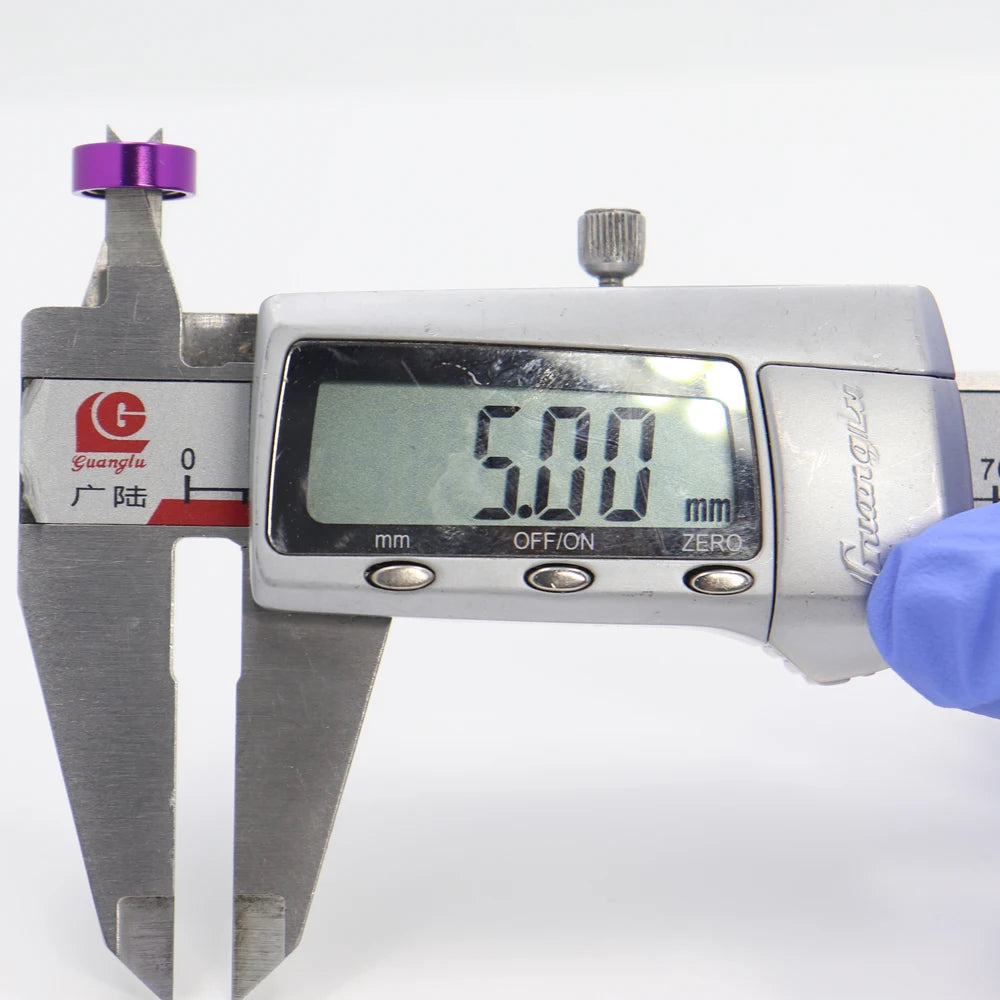 Measuring 5 mm bore diameter of ceramic stainless-steel micro casting bearing using digital caliper