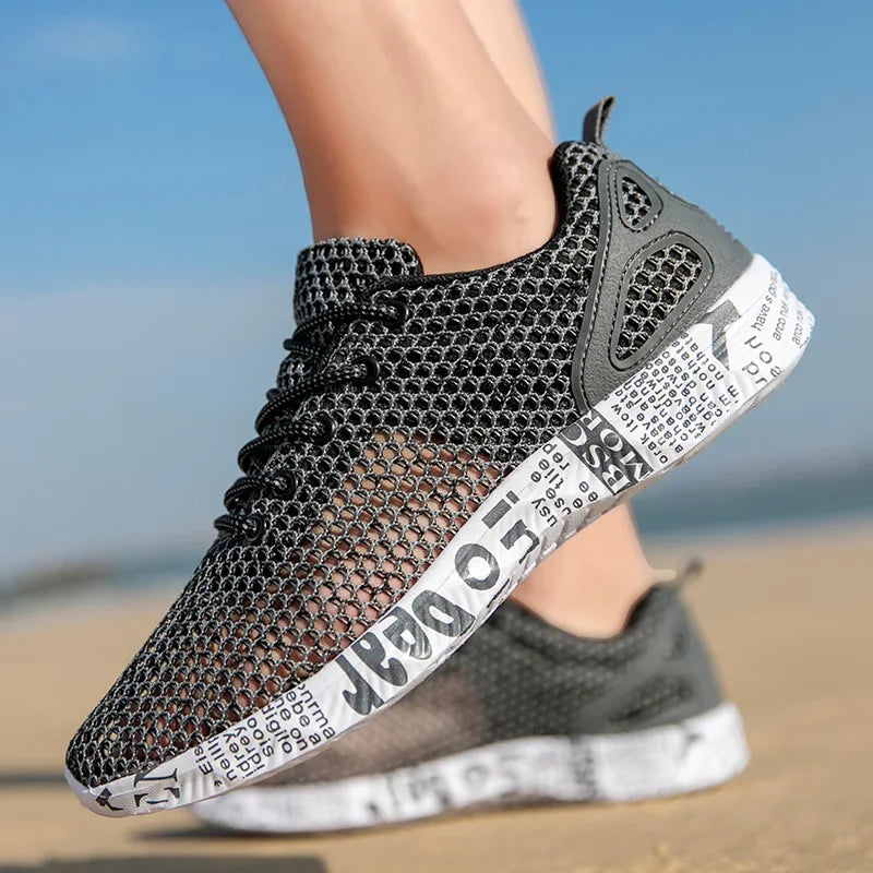 Men’s grey mesh water shoes shown from rear angle outdoors