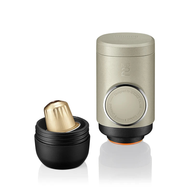 Nespresso capsule compatible Minipresso NS2 portable espresso machine showing opened chamber and capsule insert