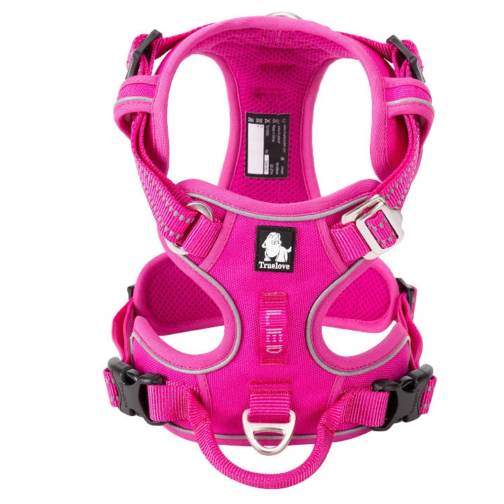 Pink padded dog harness with reflective trim and front ring
