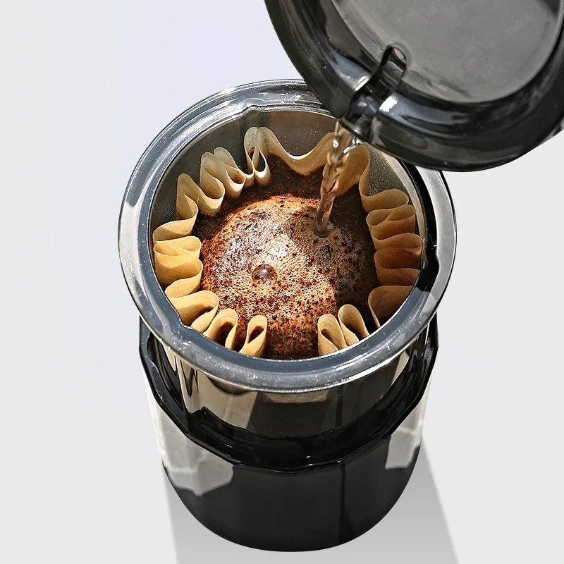 Close-up of portable pour-over coffee filter brewing a rich cup, showing compact design and smooth extraction
