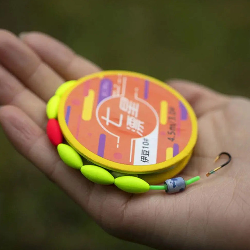 Angler holding pre-tied carbon steel fishing hook and line set with float stoppers