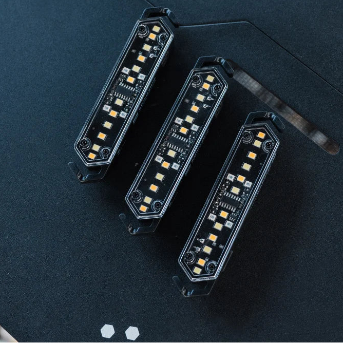 Multiple LED tent rope warning lights on table