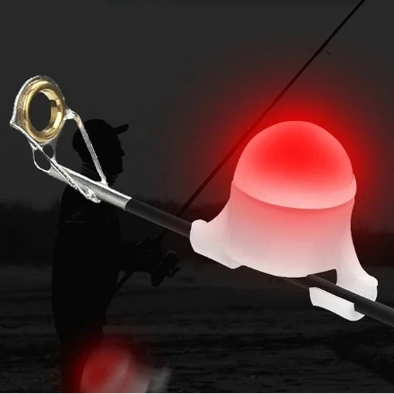 Red LED rod tip bite alarm indicator on fishing rod