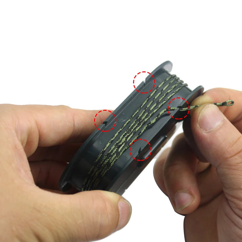 Hand pulling fishing line from compact rig spool holder for setup