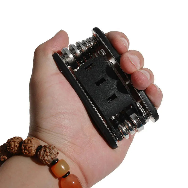 ROCKBROS bicycle multi-tool held in hand showing compact size