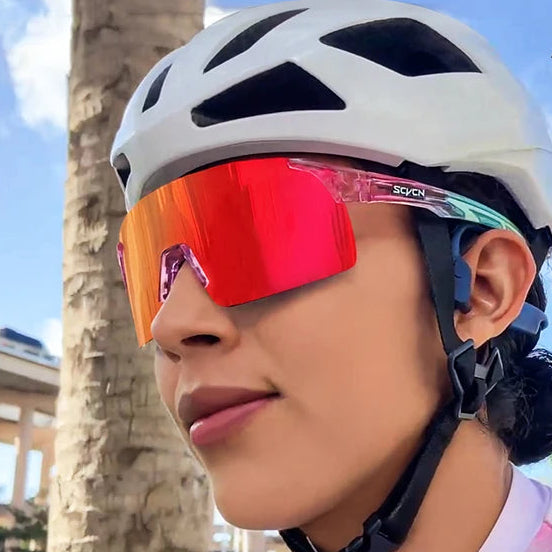 Cyclist wearing SCVCN photochromic red lens sports sunglasses with aerodynamic fit for cycling and outdoor activities