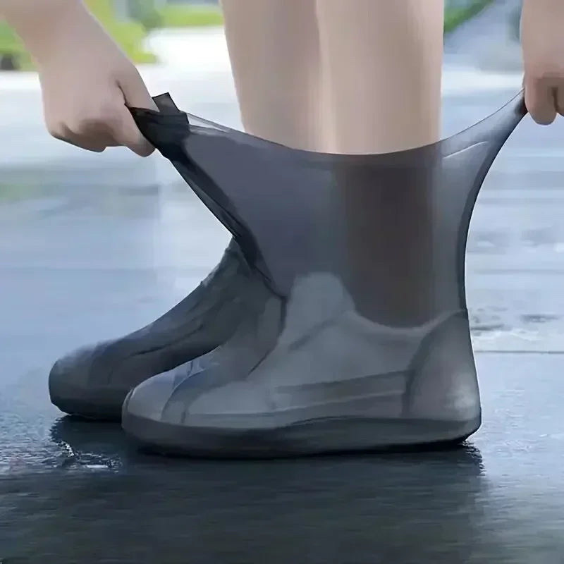 Grey silicone shoe covers shown being pulled on over shoes