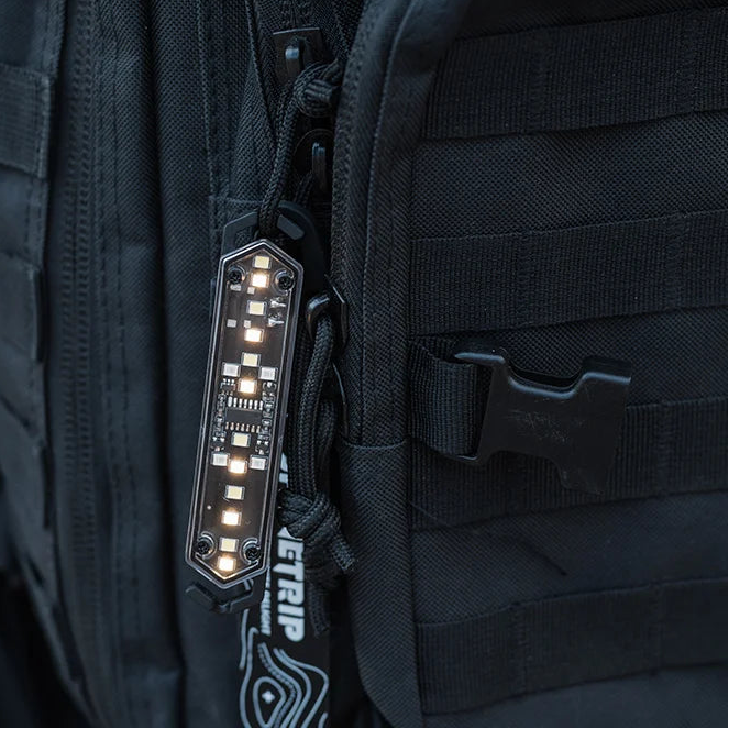 LED rope warning light clipped to backpack strap