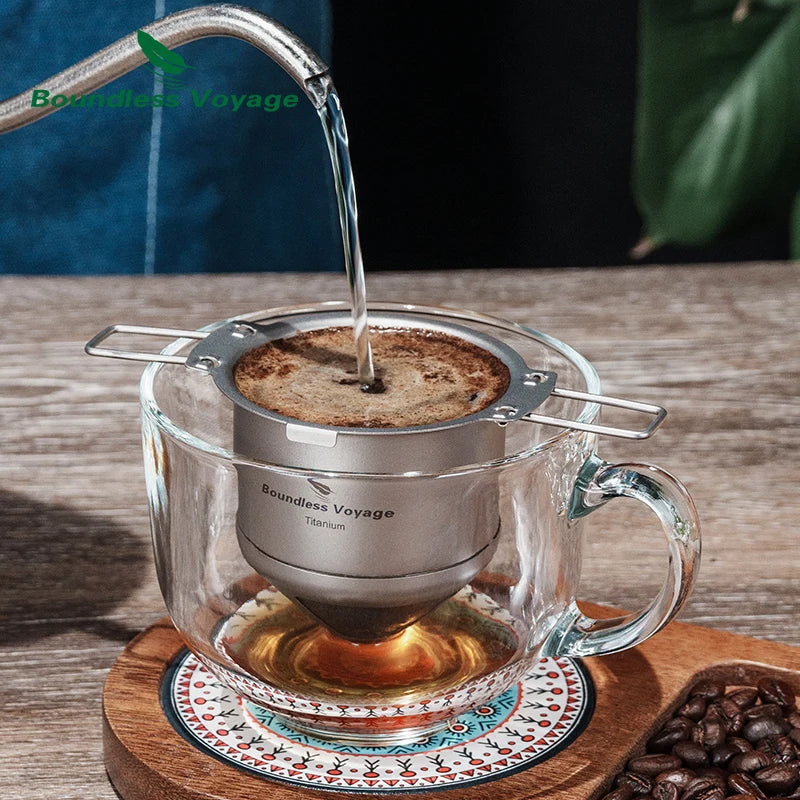 Hot water poured through titanium coffee filter into glass mug for smooth hand-brewed coffee at home or outdoors