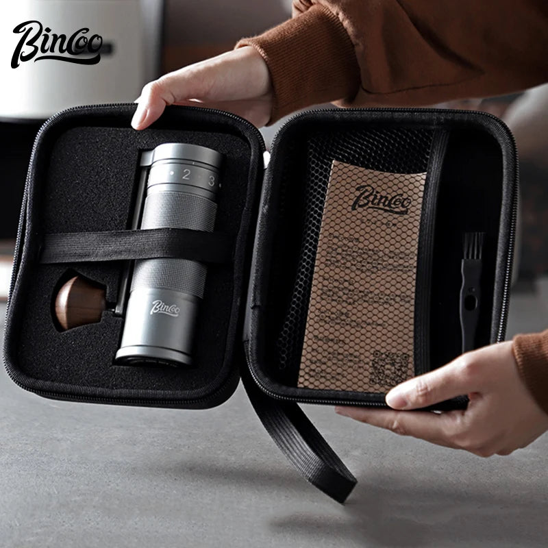 Titanium coffee grinder packed in travel case with accessories for portable brewing setup