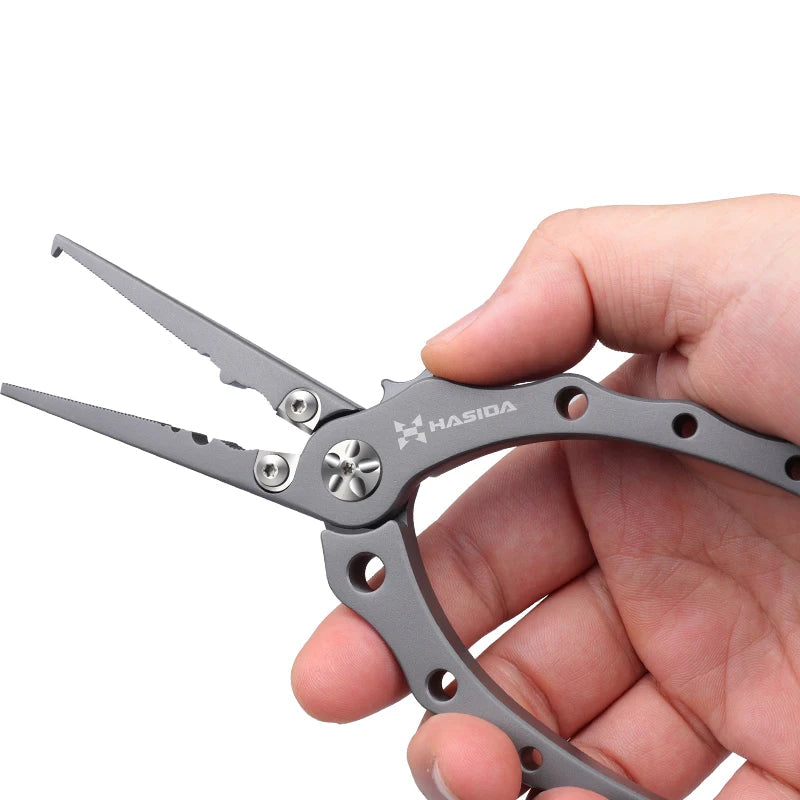 Titanium fishing pliers with replaceable tungsten line cutter