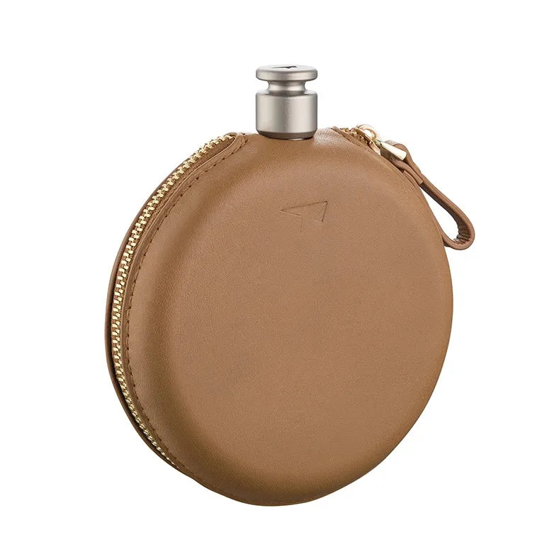 Round titanium flask inside brown leather zip case