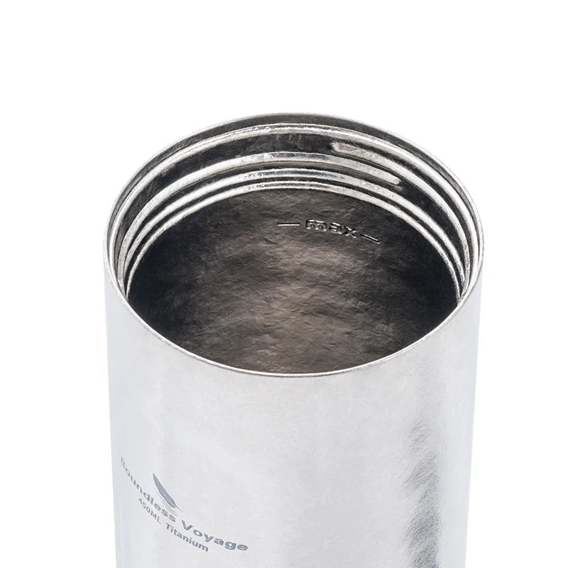 Inside view of titanium French press mug showing fine mesh and double-wall insulated construction