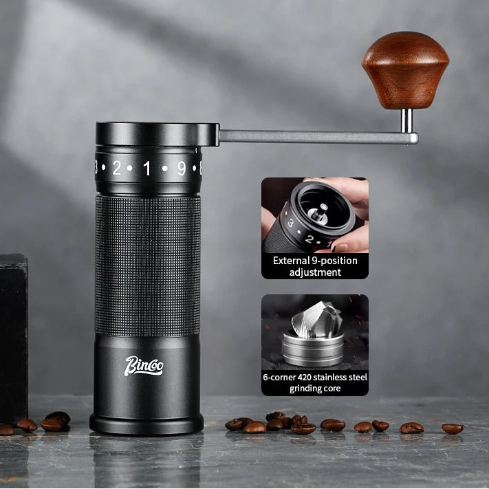 Folding hand coffee grinder with black finish showing compact, portable brewing tool design