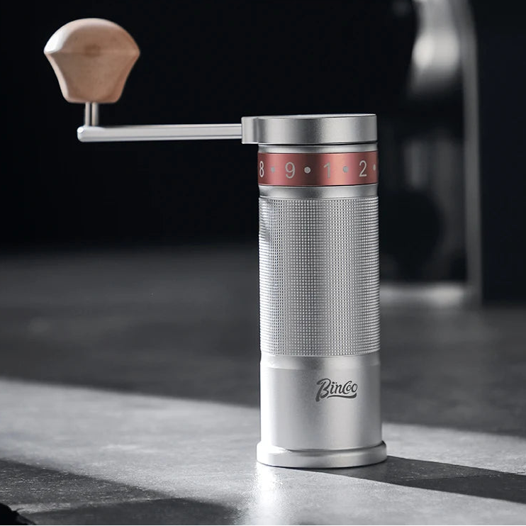 Silver folding coffee grinder with six-star stainless steel burr and smooth grind performance