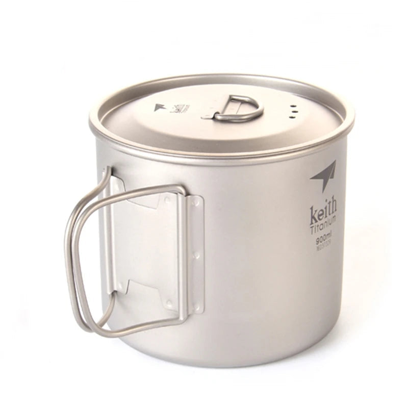 Small titanium camping mug with lid and handle