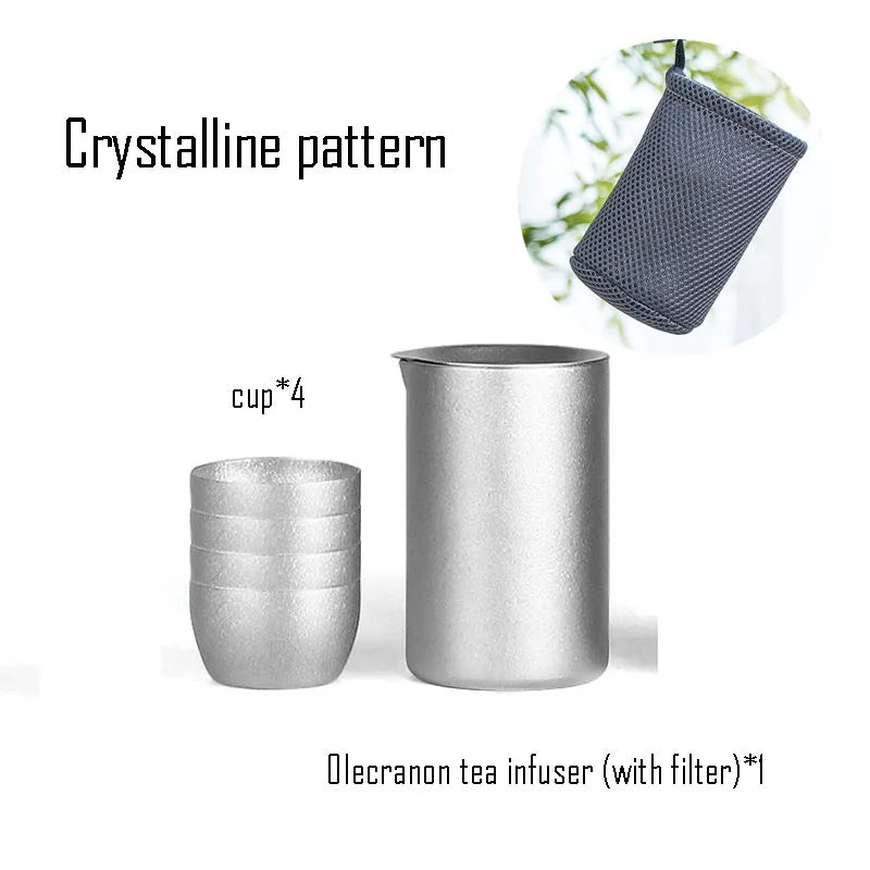 Titanium tea infuser with crystalline pattern, four matching cups, and mesh storage bag ideal for travel or outdoor brewing