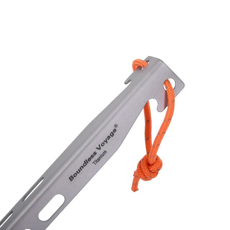 Titanium tent stake close up with orange pull cord