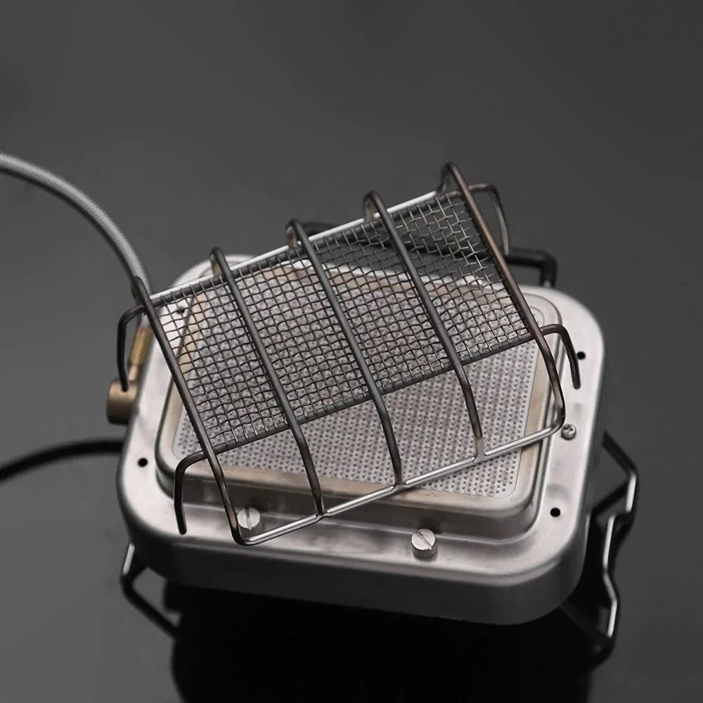 Top view of infrared camping gas burner with metal grid and ceramic heating element