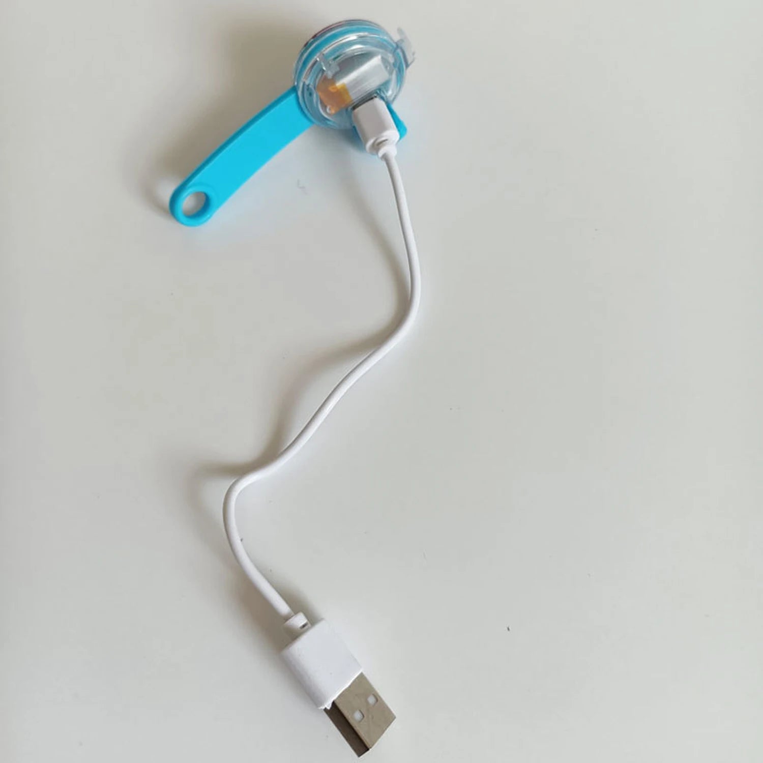 USB charging cable connected to LED dog collar light