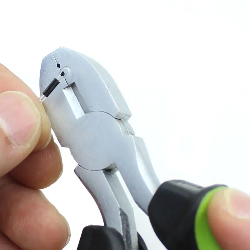 Angler using crimping pliers to make strong knotless fishing leaders with coated or fluorocarbon line