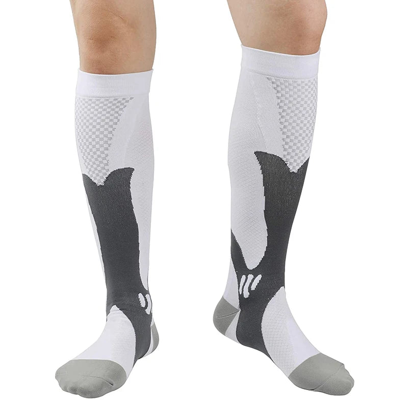 White and grey over the calf compression socks worn