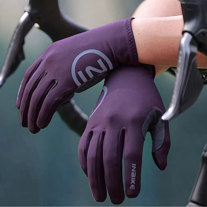 Purple full finger winter cycling gloves on handlebars