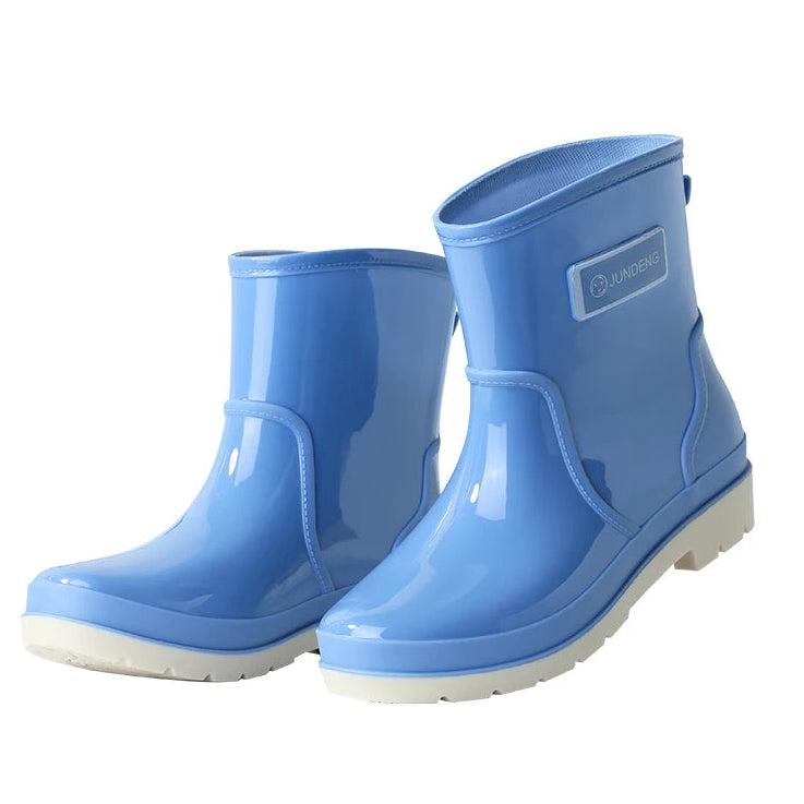 Blue women’s ankle gumboots side view on white background