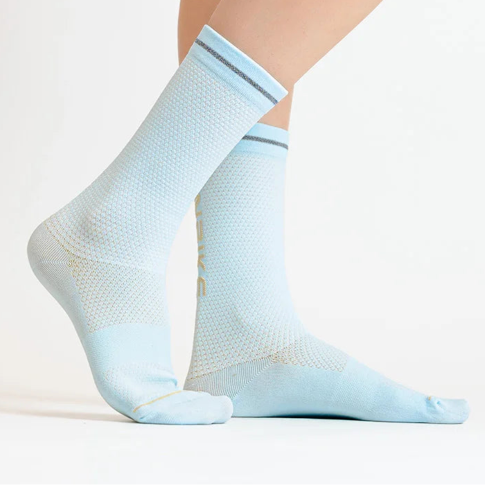 Light blue women’s crew sports socks worn on legs