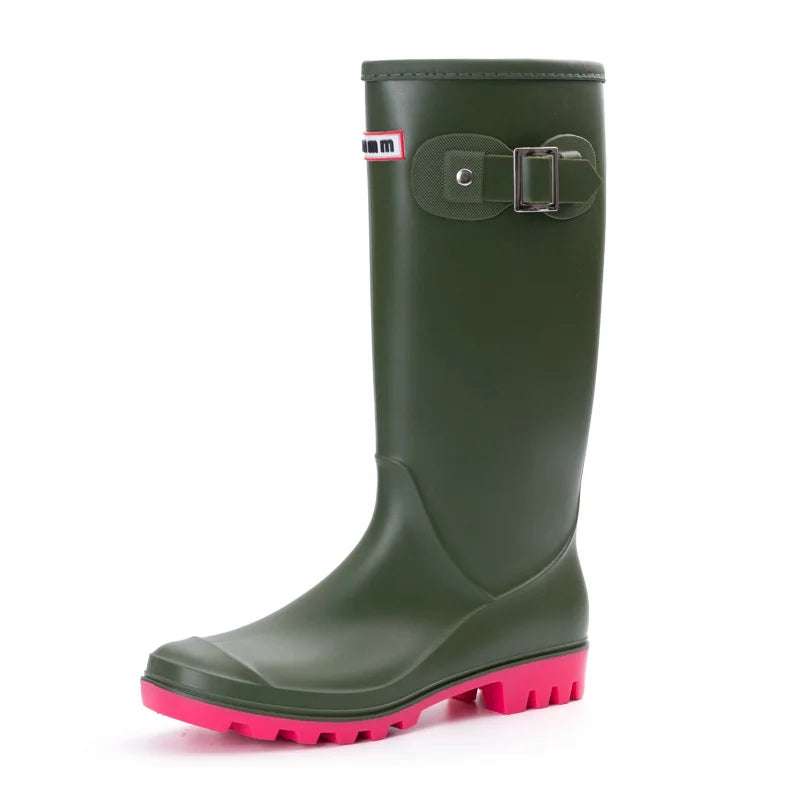 Green women’s knee high gumboots side view with flat platform sole