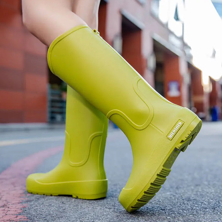 Green women’s mid-calf gumboots with waterproof PVC finish