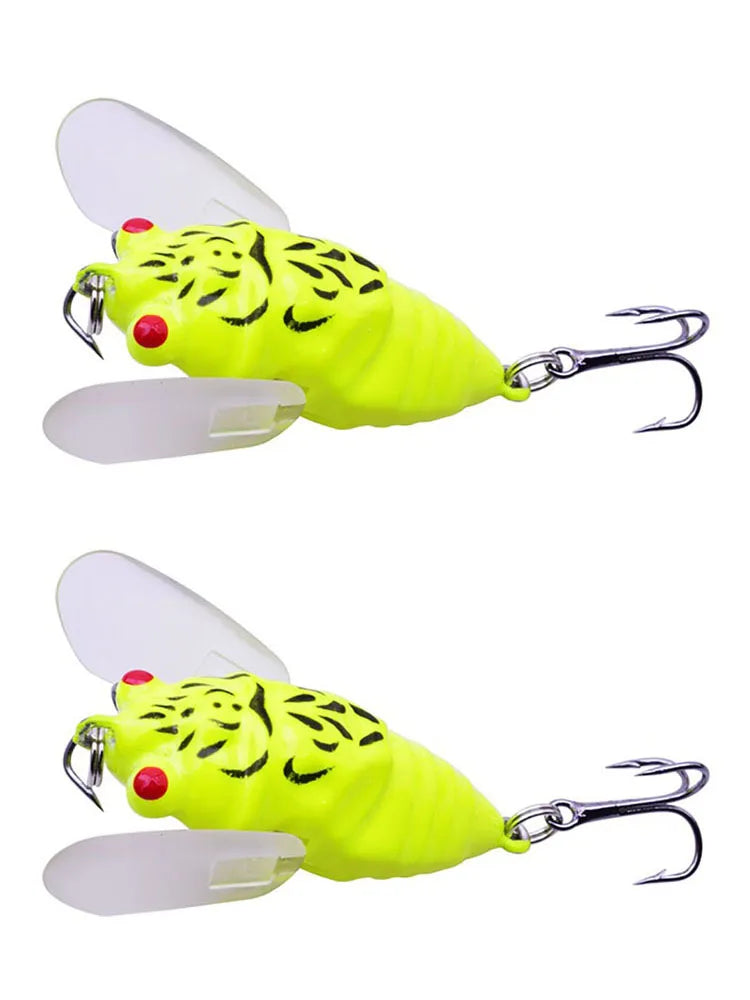 Two yellow cicada-style fishing lures shown together
